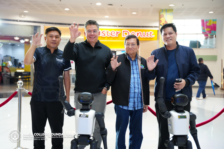 Pres. Villanueva, Dr. Layug, Remulla, and Wesley Villanueva in a group photo with a Tiger Humanoid Robot