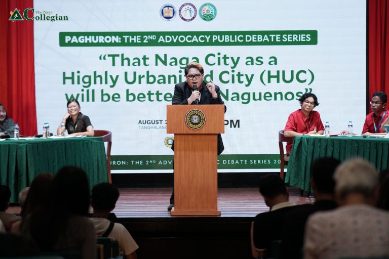 TNC photo of a debater on a podium